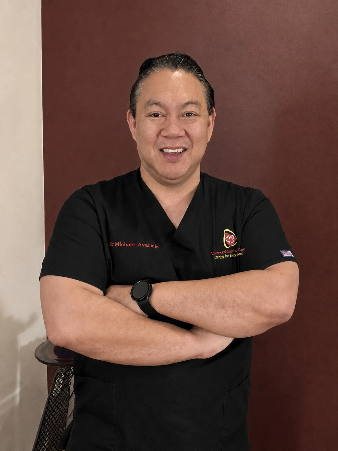 Dr. Michael Avaricio smiling in his Advanced Cardiac Care scrubs