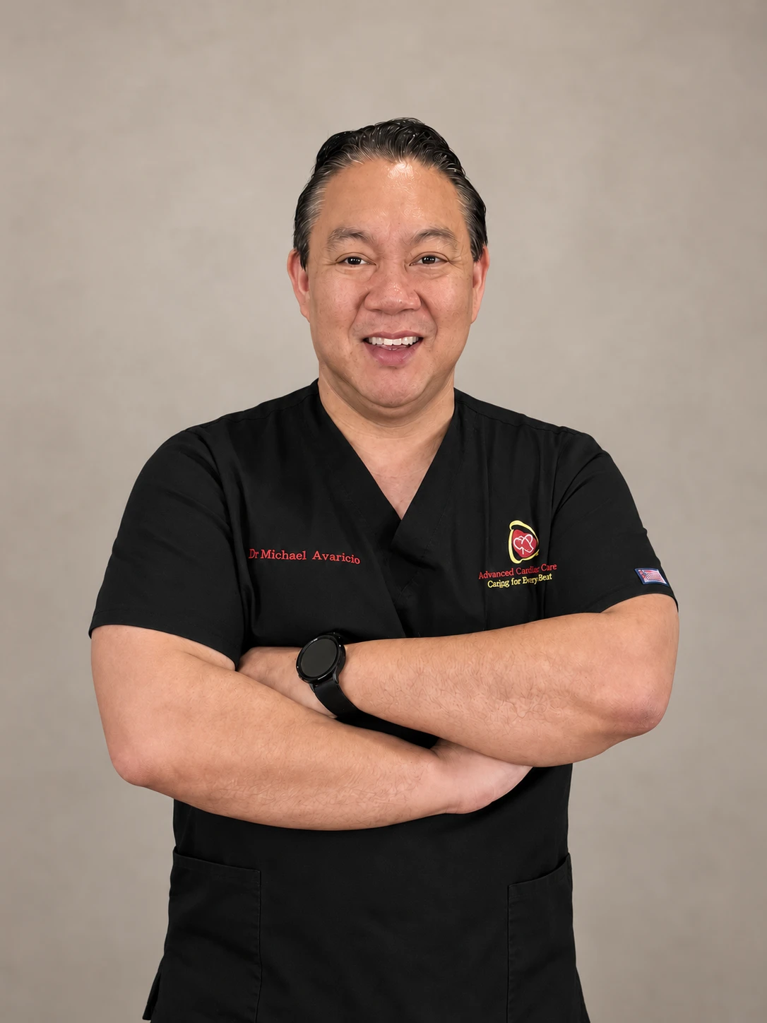 Dr. Michael Avaricio smiling in his Advanced Cardiac Care scrubs